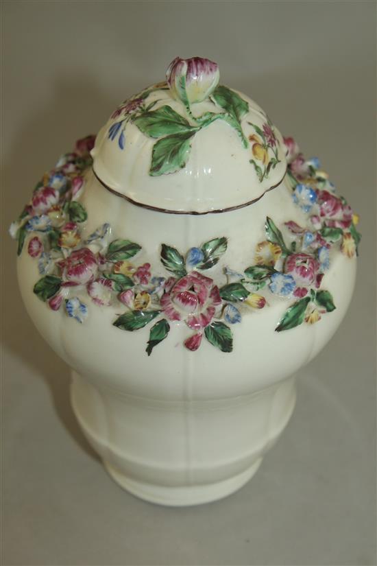 A Mennecy porcelain floral encrusted ogee-shaped vase and cover, c.1760, 17.5cm